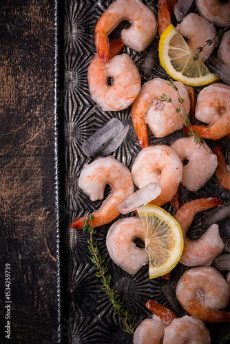Frozen uncooked prawns or shrimps with lemon