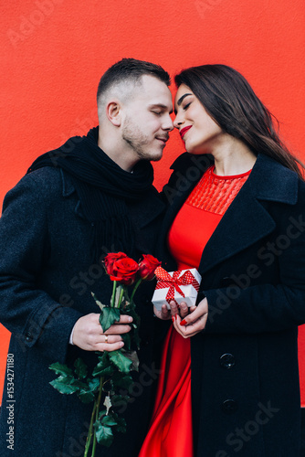 man and woman with rose