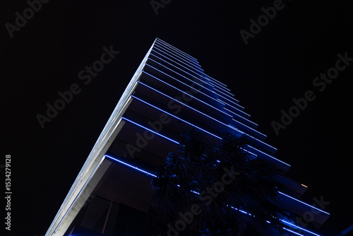 Photography Blue illumination of a tall building at night