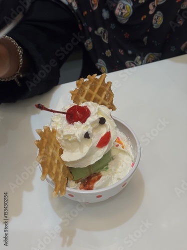 Many cups of ice cream on the white table