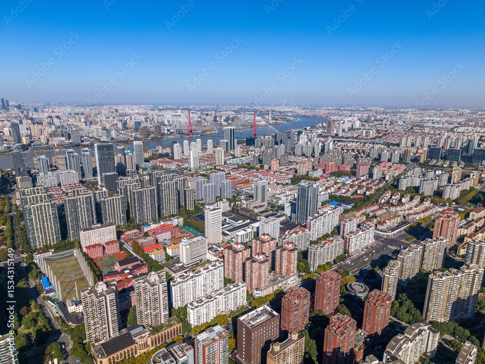Fototapeta premium The drone aerial view of Huangpu River and residential district of Pudong, Shanghai. 