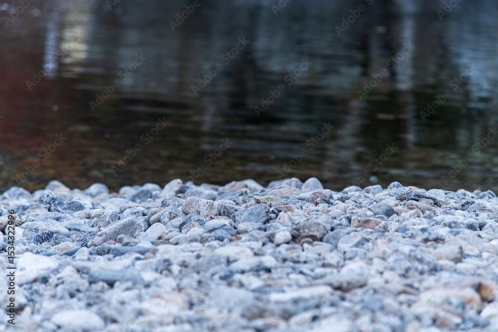 Fototapeta premium pebble shore and stream in the autumn valley