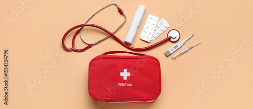 First aid kit and pills on ...
