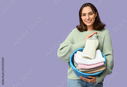 Young woman with laundry ba...