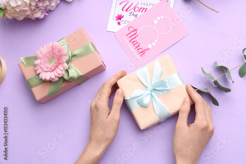 Female hands with gift boxe...