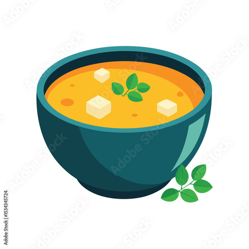 Dark Teal Bowl of Orange Soup with Tofu Cubes and Green Herbs yellow