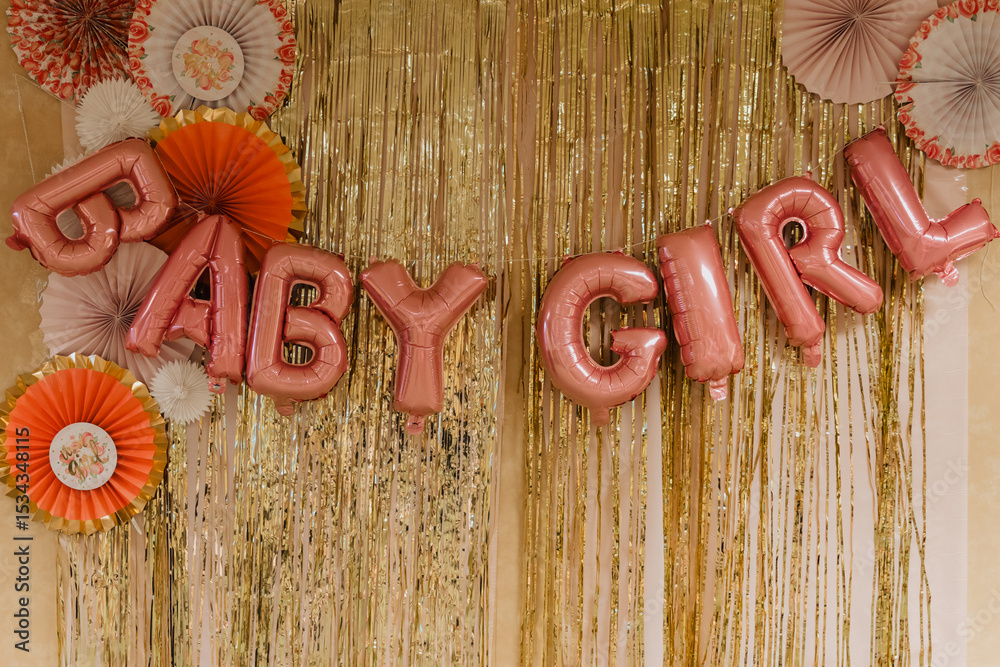 Φωτογραφία Gold fringe party backdrop with pink “Baby Girl” foil balloon letters and decora