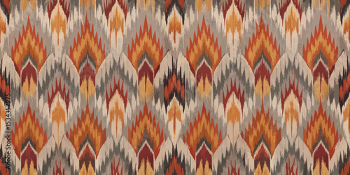 Vibrant textile pattern with warm tones of red, orange, and gray.