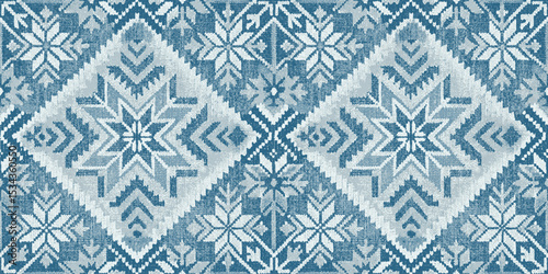 Blue and white geometric snowflake pattern in a cozy design.