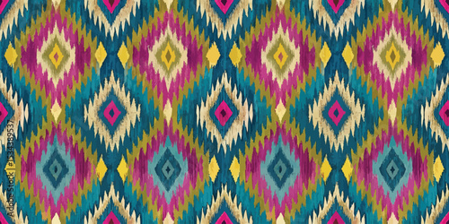 Colorful ikat pattern featuring vibrant diamonds in rich blues, pinks, and yellows.