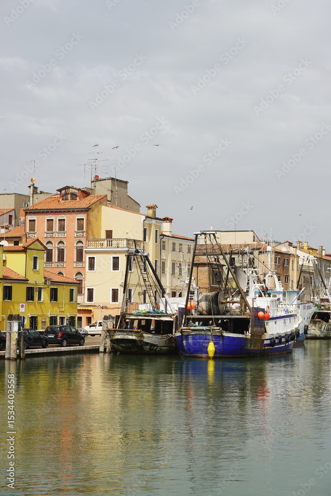 Fototapeta premium Old canals and streets in Chioggia, Italy 