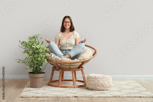 Young woman meditating in c...