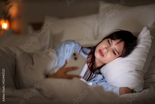 Young woman using mobile ph...