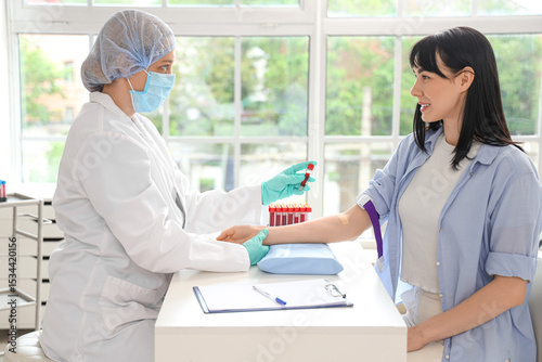 Young woman and doctor with...
