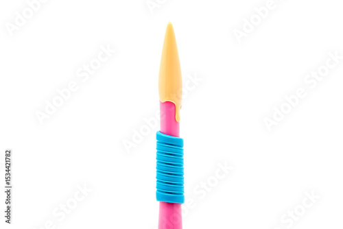 Close-up View of a Pink and Yellow Decorating Tool, Featuring a Unique Spiral Design Element, Ideal for Cake Decorating, Crafts, and Other Creative Applications.