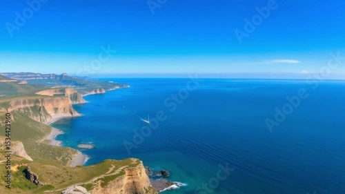 Coastal cliffs meeting deep blue ocean
