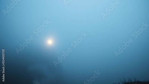 Ethereal sunrise veiled in hazy blue