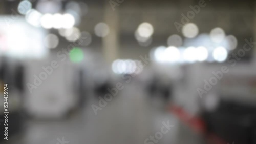 Wallpaper Mural People walking in building. Building with walls, floor, ceiling illuminated lamps. Silhouettes of people indoors. Many people walking. Men and women in tall hall. Exhibition center. Blurred background Torontodigital.ca