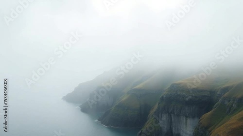 Foggy cliffs meet the ocean