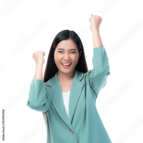 Beautiful successful young businesswoman in green blazer celebrating achievement with raised fists, smiling confidently, expressing happiness and business success, isolated on a transparent background