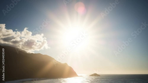 Sunburst over mountains and ocean