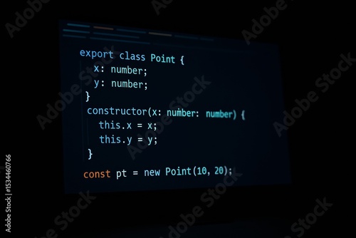 Close-up of programming code on a dark screen. It shows a TypeScript/JavaScript class with colorful syntax highlighting. A concept for software development, web design, computer science, and modern te