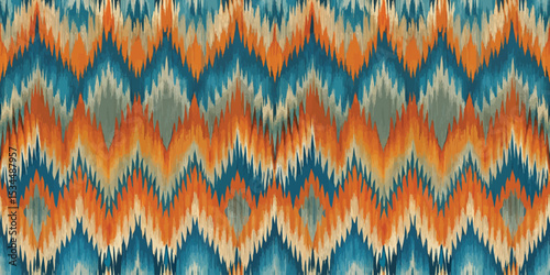 Vibrant zigzag patterned fabric in shades of blue, orange, and cream.