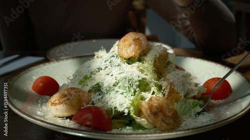 Fresh Caesar Salad with Grilled Shrimp and Parmesan. Gourmet Seafood Dish