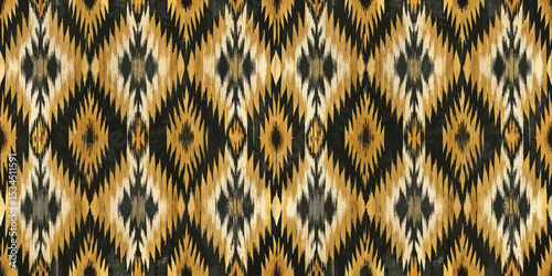 Elegant abstract ikat pattern in warm tones of gold, black, and cream.