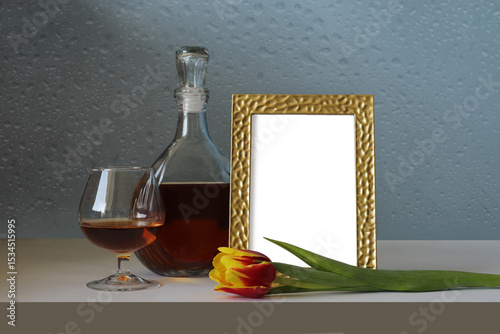 photo frame on the table with a tulip