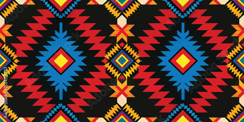 Vibrant geometric pattern featuring red, blue, and yellow shapes on a black background.