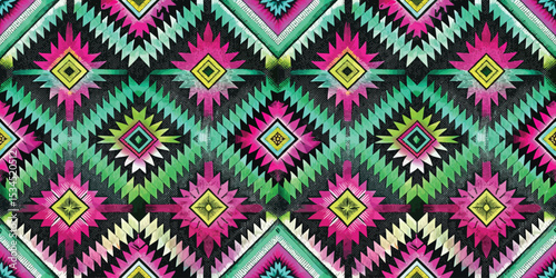 Vibrant geometric pattern in bold colors featuring intricate diamond shapes.