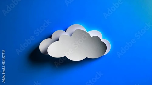 Fluffy white paper clouds float on a vibrant blue background in an overhead still life studio composition, conceptual and clean