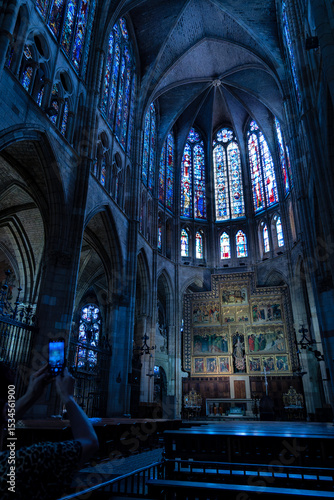 Majestic stained glass windows casting colorful light inside the gothic cathedral of leon, a masterpiece of spanish architecture