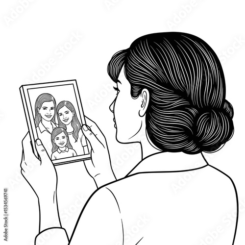Woman with nostalgic expression holding a photo frame of family members
