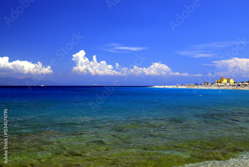 Fototapeta Naklejka Na Ścianę i Meble -  Sea background, summer beach, waves in beautiful turquoise sea. Rhodes Greece travel, vacation and holidays