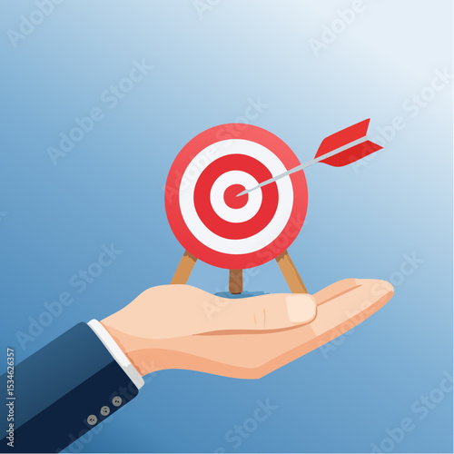 Goal or target, focus and concentration to achieve success, purpose or objective, aiming at target bullseye, accuracy, challenge and aspiration, businessman hand hold target with arrow hit bullsey