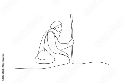 Elderly man with beard sitting with a stick and bag