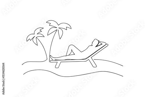 Person relaxing on a beach lounger under palm trees