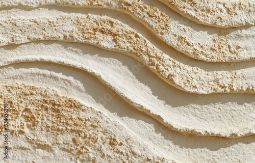 Abstract limestone landscape with flowing textures illuminated by golden hour light