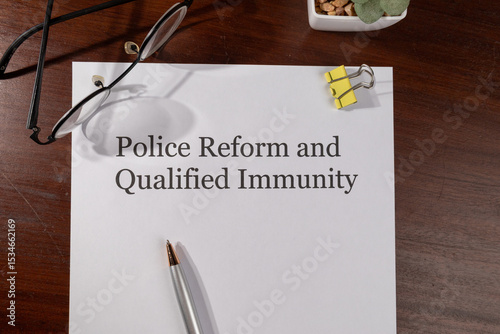 Police Reform and Qualified Immunity Document with Pen – Justice System Reform Concept photo