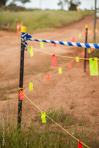 Tape and tags blocking off new road being built