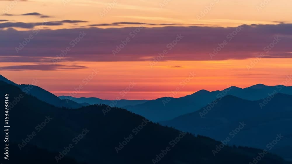 Glowing Sunset Over Dark Mountain Ridges Creates a Stunning Vista Glowing Sunset Over Dark Mountain Ridges Creates a Stunning Vista