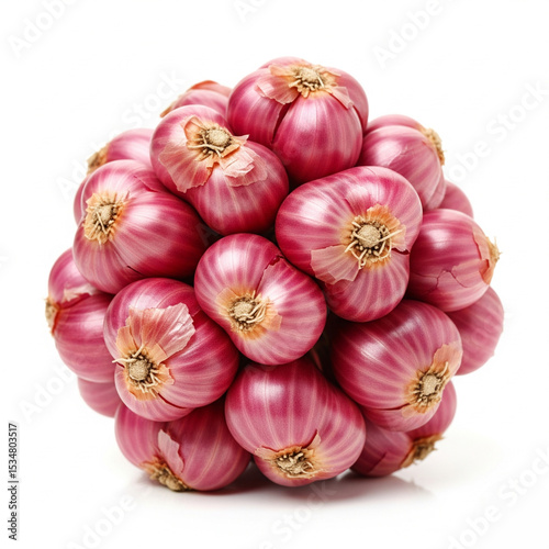 Thai shallots (Allium ascalonicum), small red-purple bulbs with papery skin, isolated on clean white background