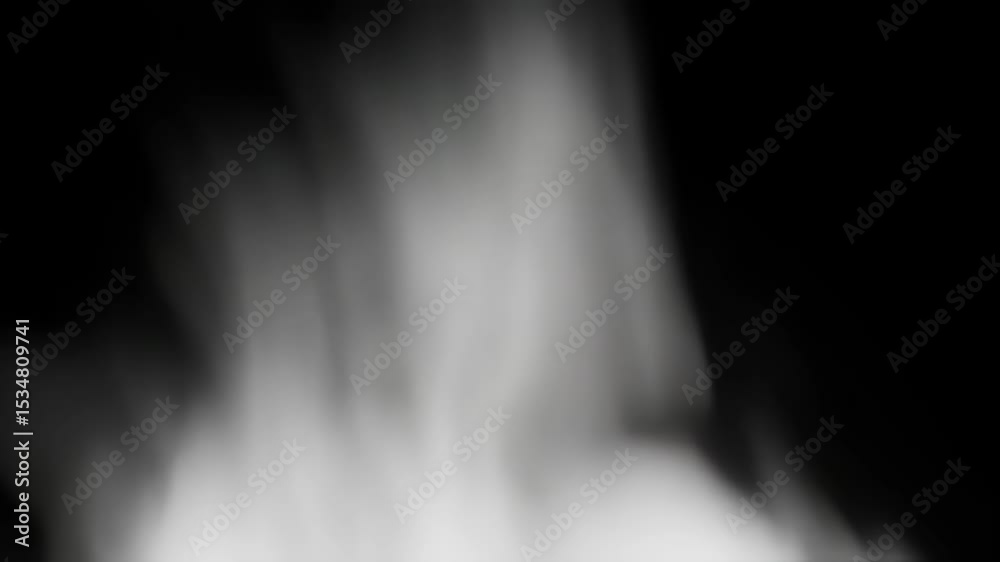 Abstract ethereal flowing white smoke or fog rising against a stark dark black background in an atmospheric blurry effect.