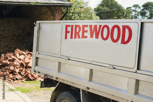 Firewood delivery in a small truck photo