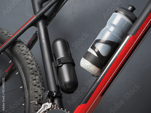 Portable Electric Pump with Battery, attached on Bicycle with water bottle.