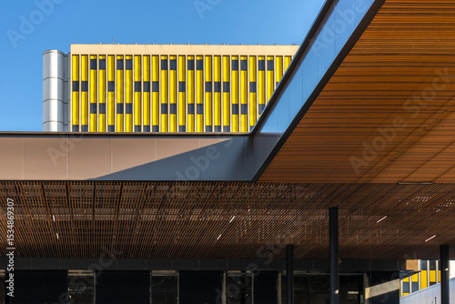 Contemporary wood and metal canopy at Distrito Anhembi, São Paulo. Modern architecture blends with colorful urban structures in Brazil’s major event and convention hub.