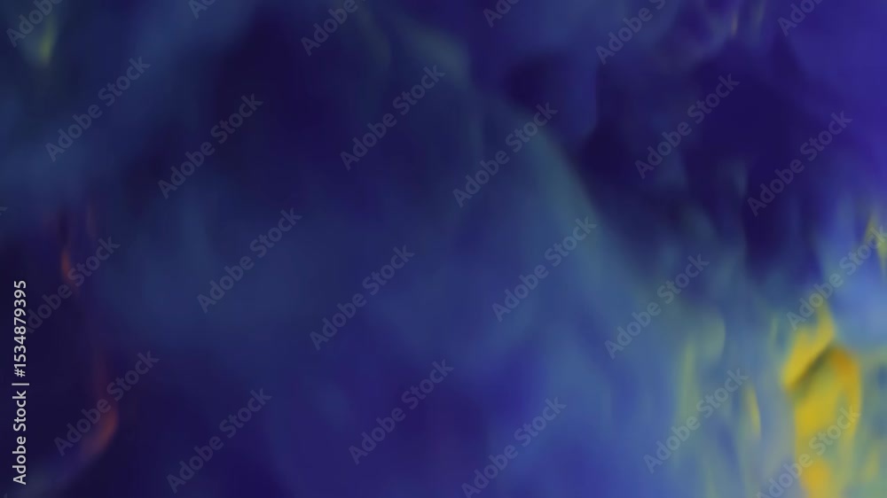 Abstract flowing mixture of yellow, orange and blue colored ink in water creating a cloud of vibrant dye diffusion