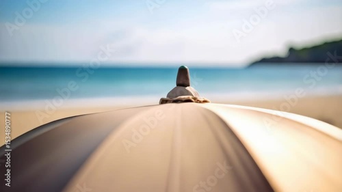 Elegant beach umbrella casting shade on golden sand with turquoise ocean and blue sky backdrop, creating summer vacation ambiance.